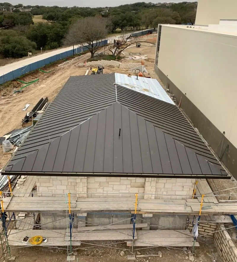 Metal roof new construction with scaffolding in Montgomery